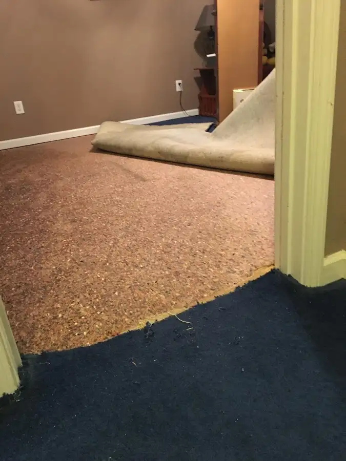 Carpet pad removal revealing water damage during Drying & Dehumidification in Crestline